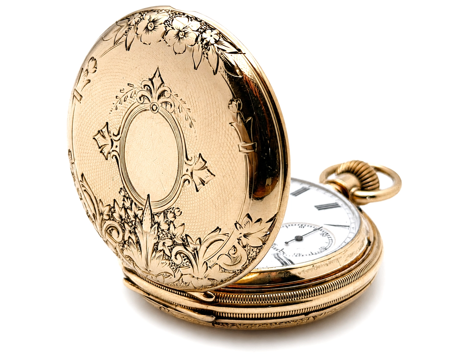 Open gold pocket watch with ornate floral engraving on case back, white dial visible inside.