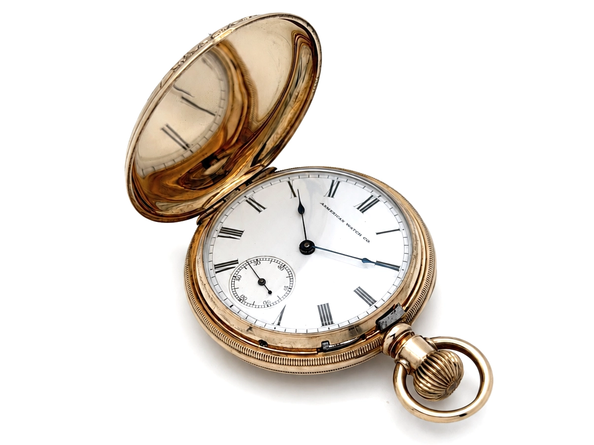 Open pocket watch with white dial, black Roman numerals, subsidiary seconds dial, gold-filled case, and amber-tinted crystal.