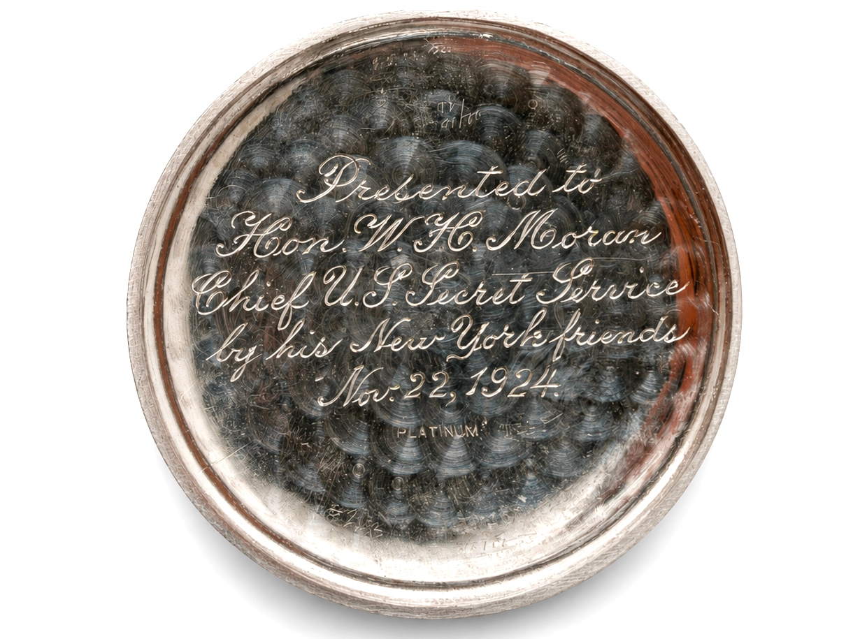 Platinum case back with script engraving, dated Nov. 22, 1924, presented to Hon. W.H. Moran.