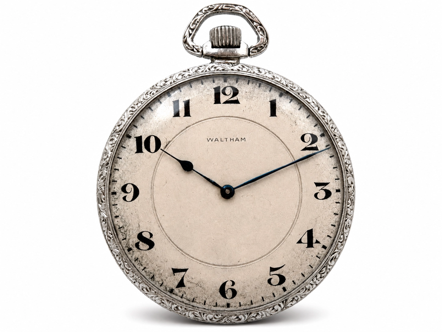 Waltham pocket watch with ornate silver case and cream dial featuring black Arabic numerals and simple hands.