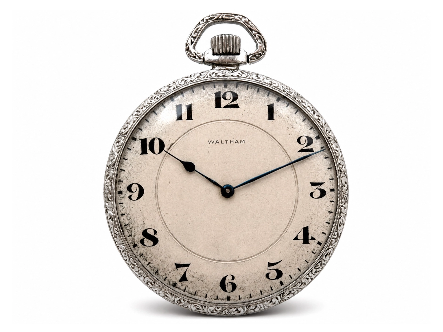 Waltham pocket watch with ornate silver case, cream dial, and black Arabic numerals showing time at approximately 10:10.