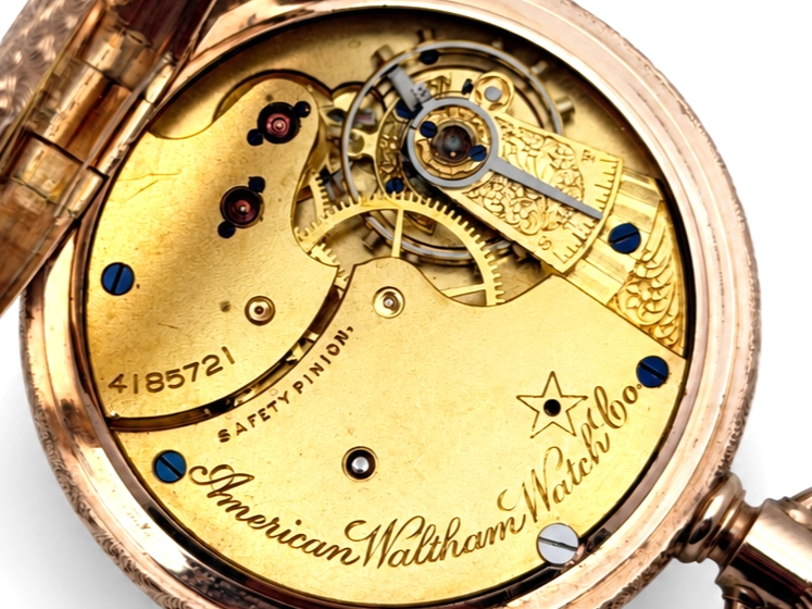 Waltham Hillside Quality Solid 14K Gold Vermicelli Case — open movement with decorated balance cock, visible jewels, safety pinion, and…