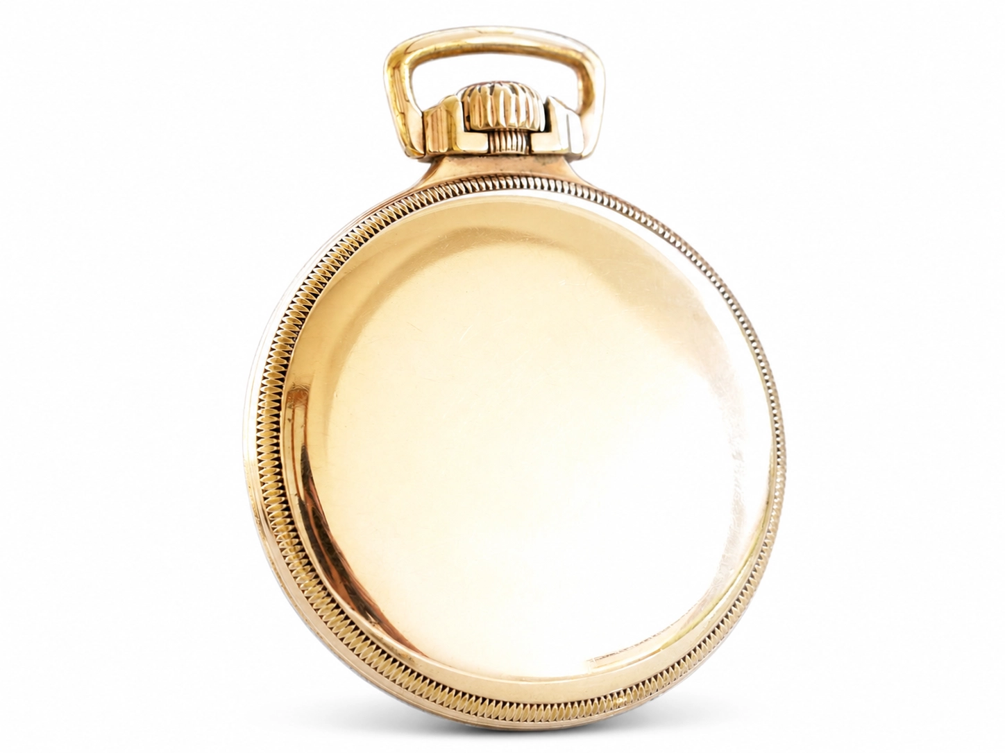 Gold-toned open-face pocket watch case with decorative bezel and bail loop, crystal removed.