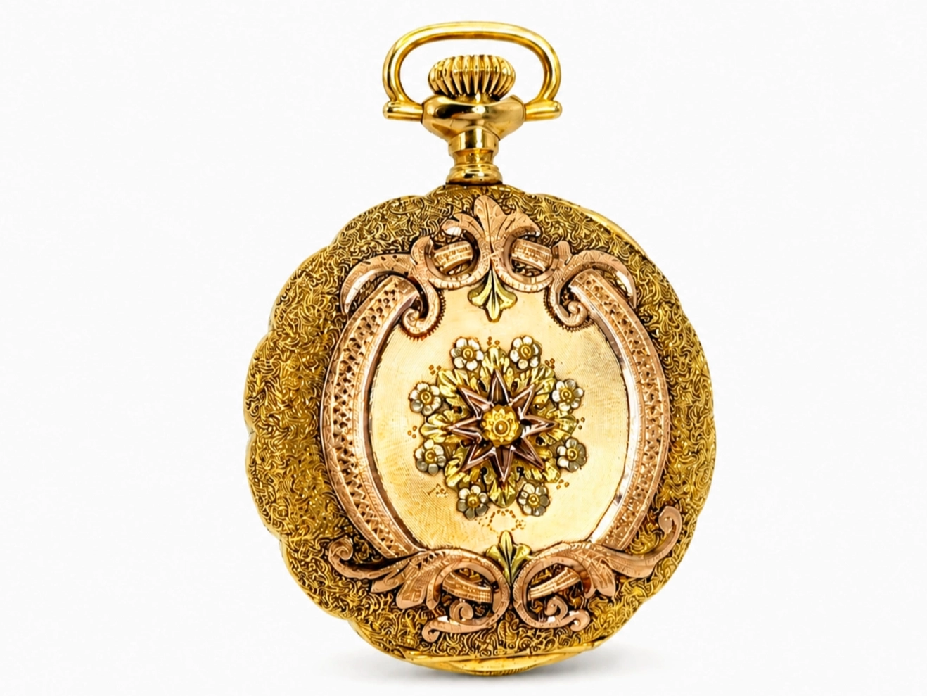 Gold pocket watch case with ornate scrollwork and central floral medallion design.