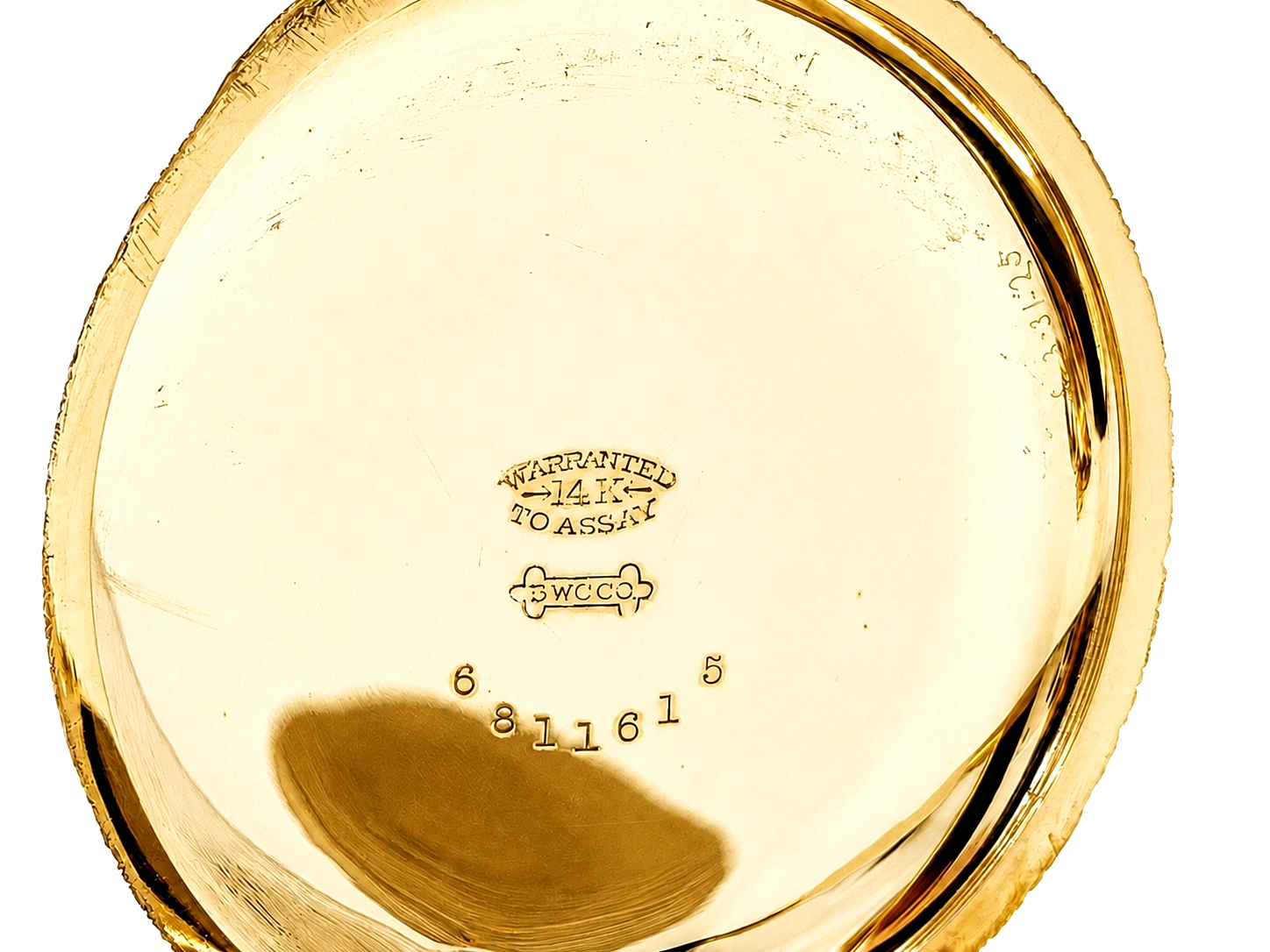 Gold case back showing "Warranted 14K To Assay" hallmark and WCCO maker mark.