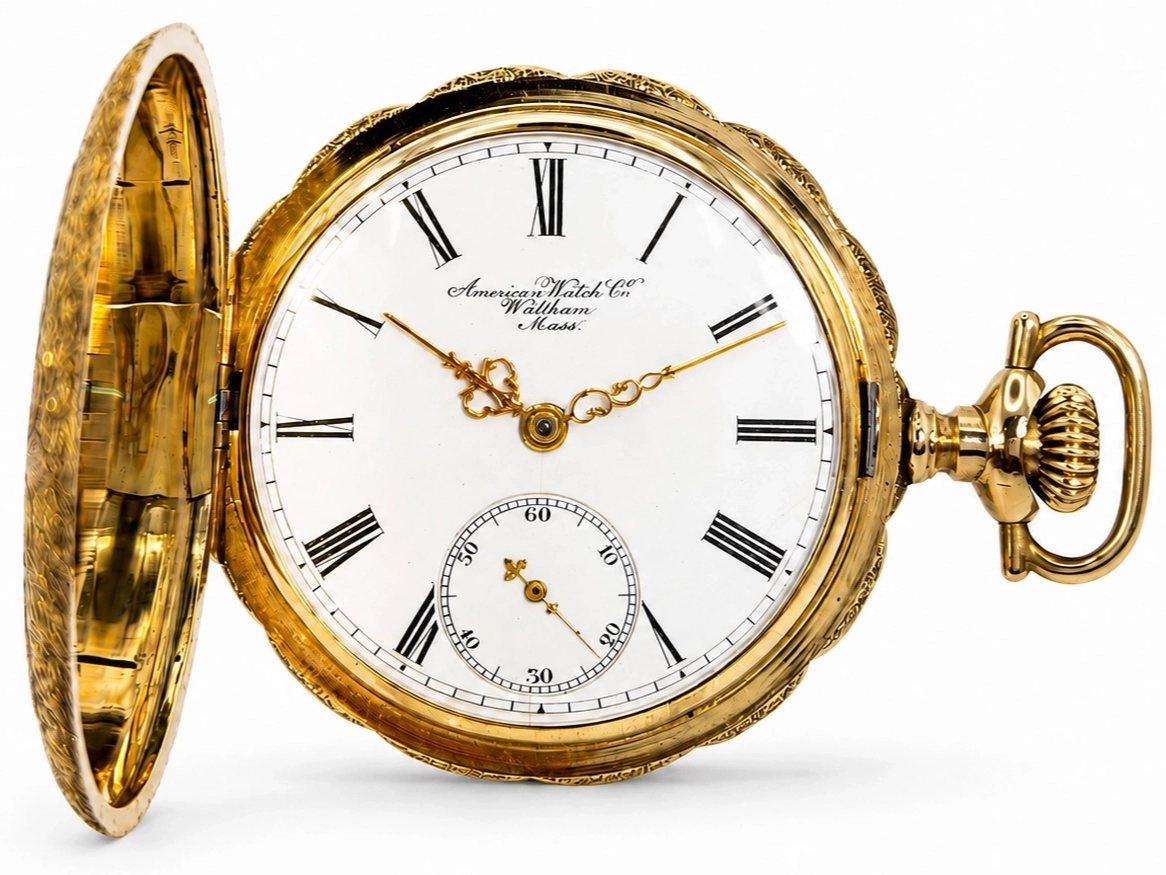 Gold hunter case pocket watch with white dial, Roman numerals, subsidiary seconds dial, and ornate bow, displayed open.