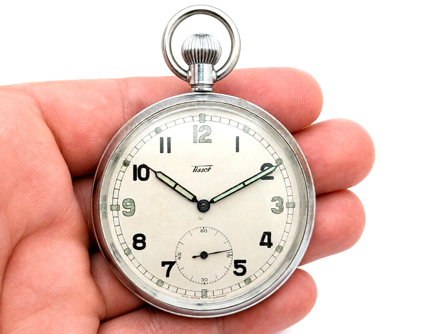 Open-face pocket watch with cream dial, Arabic numerals, subsidiary seconds dial, and metal loop crown.